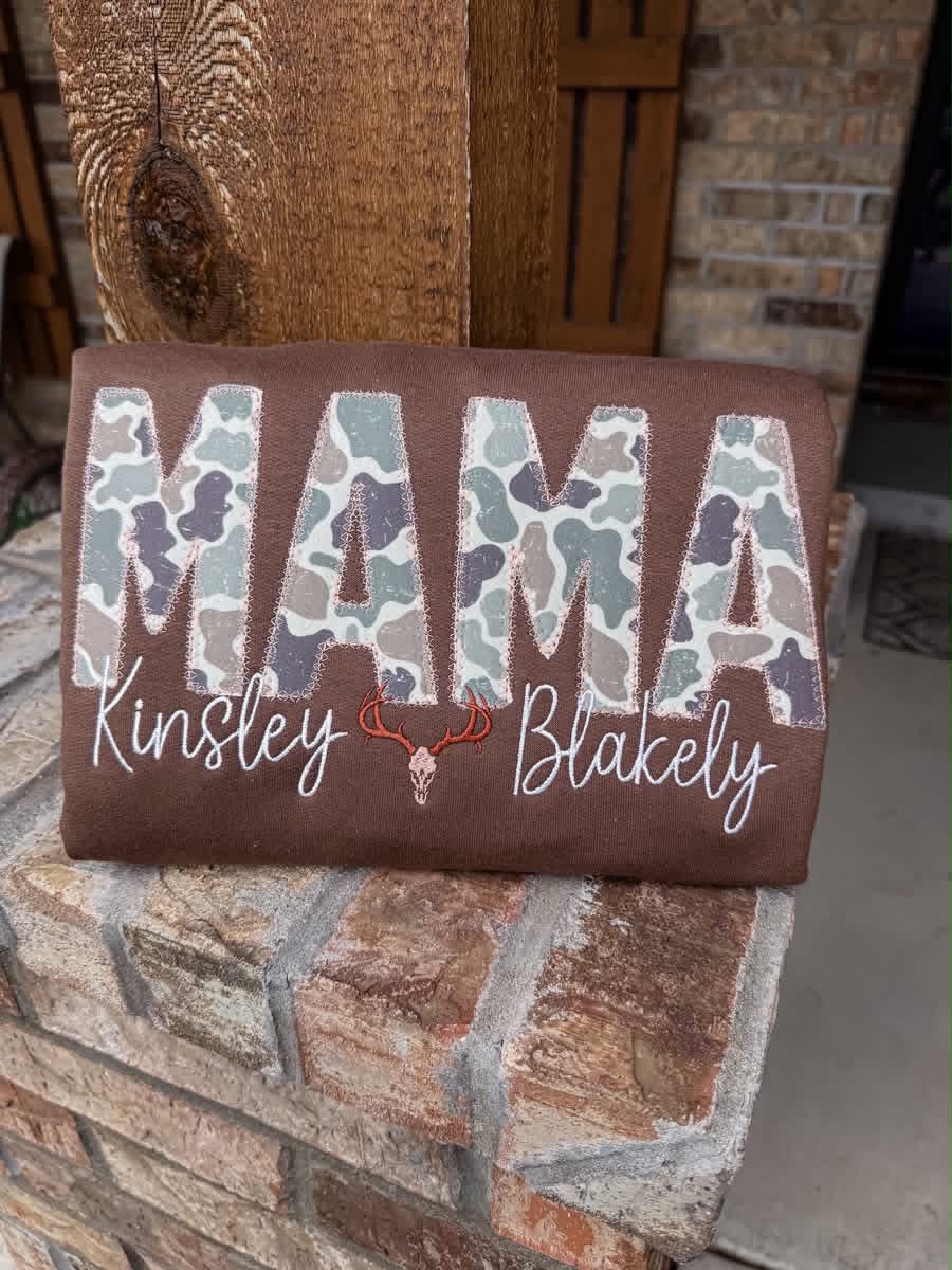 Camo Title with deer and two embroidered names, front view